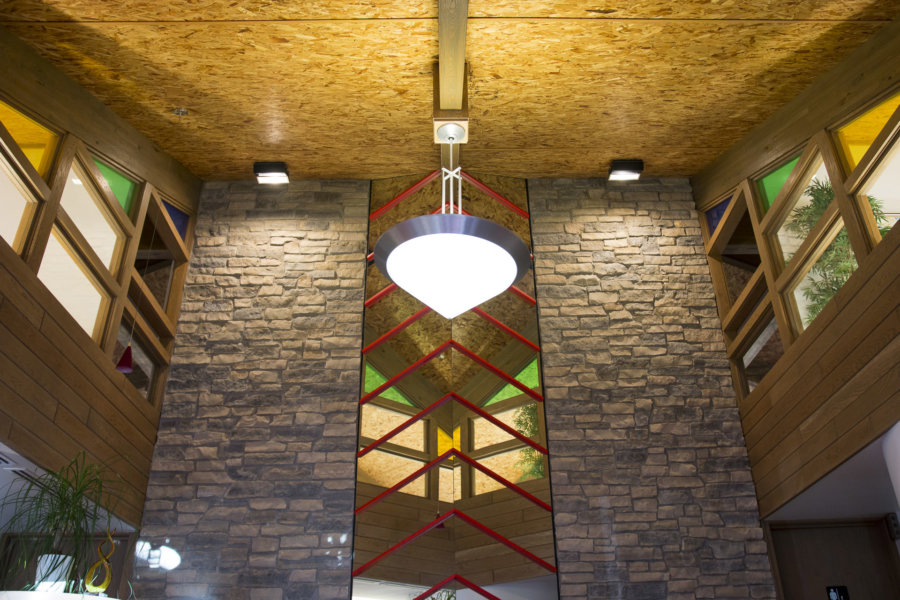 Lobby featuring stone, brick, and stained glass