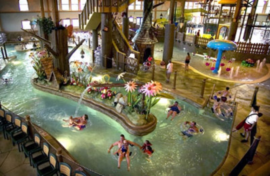 A group of people in the water at a waterpark.