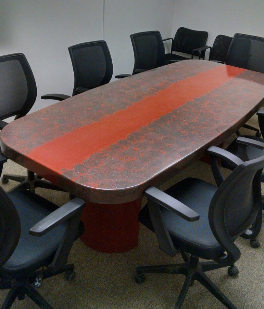 A conference table with chairs around it