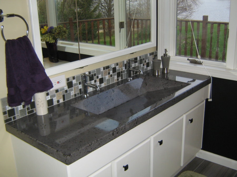 A bathroom with a sink and counter in it