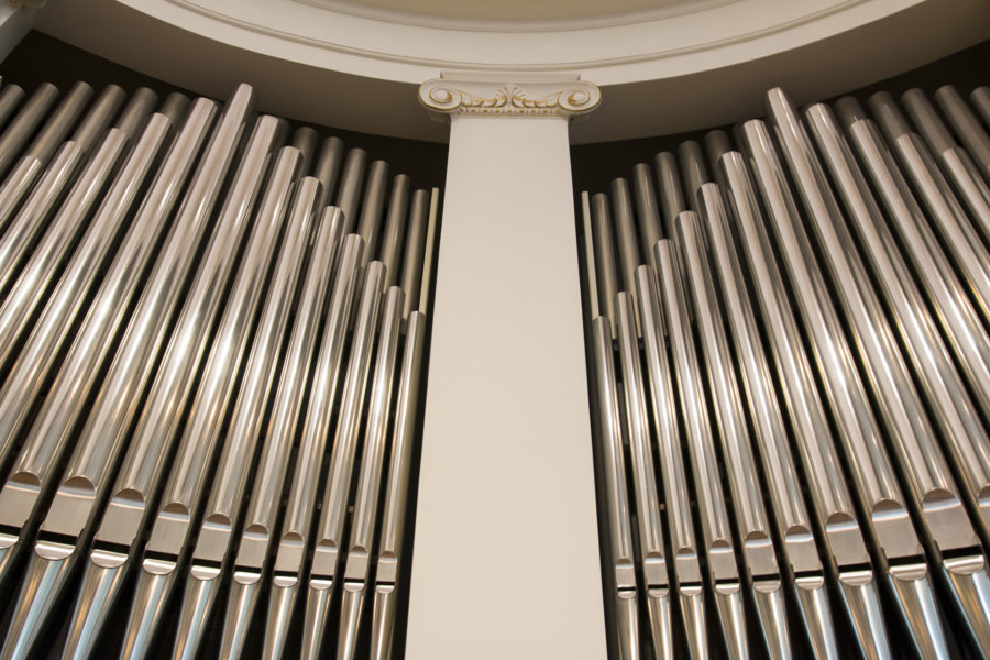 A close up of the organ pipes in an old church