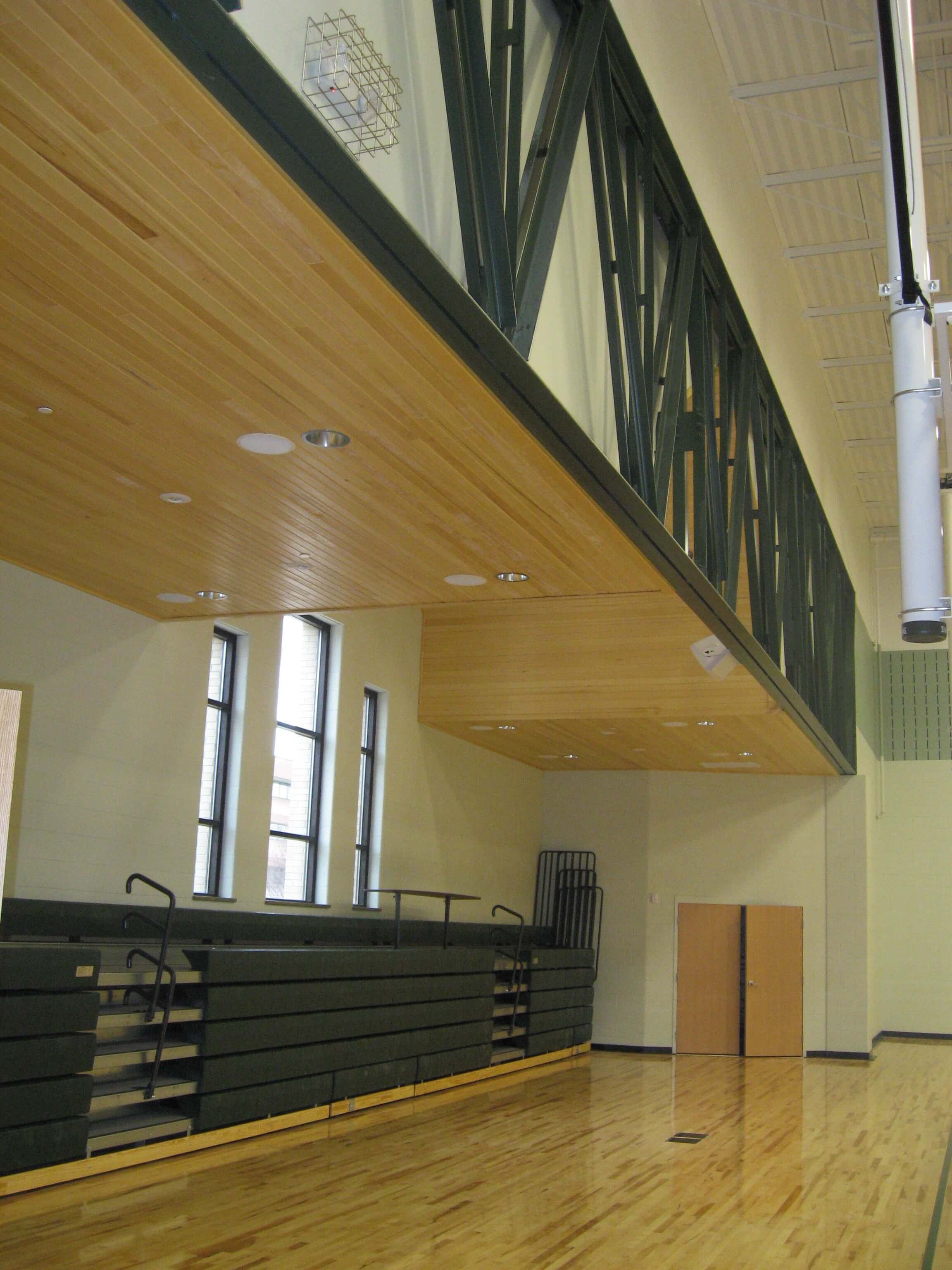 A large gym with wooden floors and walls.
