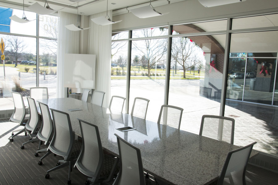 A large conference room with a view of the outside.