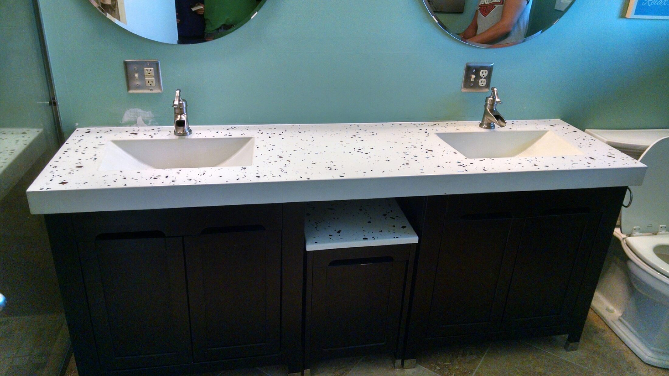 A bathroom with two sinks and mirrors